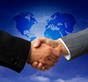 Disembodied hands making connections far above a map of the Earth